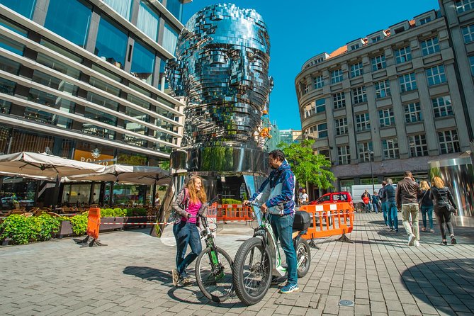 Best Sights of Prague: E-Bike or E-Scooter tour - The Lennon Wall and Charles Bridge