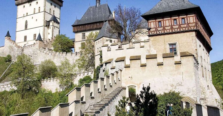 From Prague: Half-Day Karlstejn Castle Tour - Walking up to a Gothic castle on Dragon’s Rock