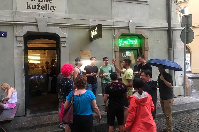 Old Prague pubs tour. Beer and dinner included! - Crossing Charles Bridge between drinks