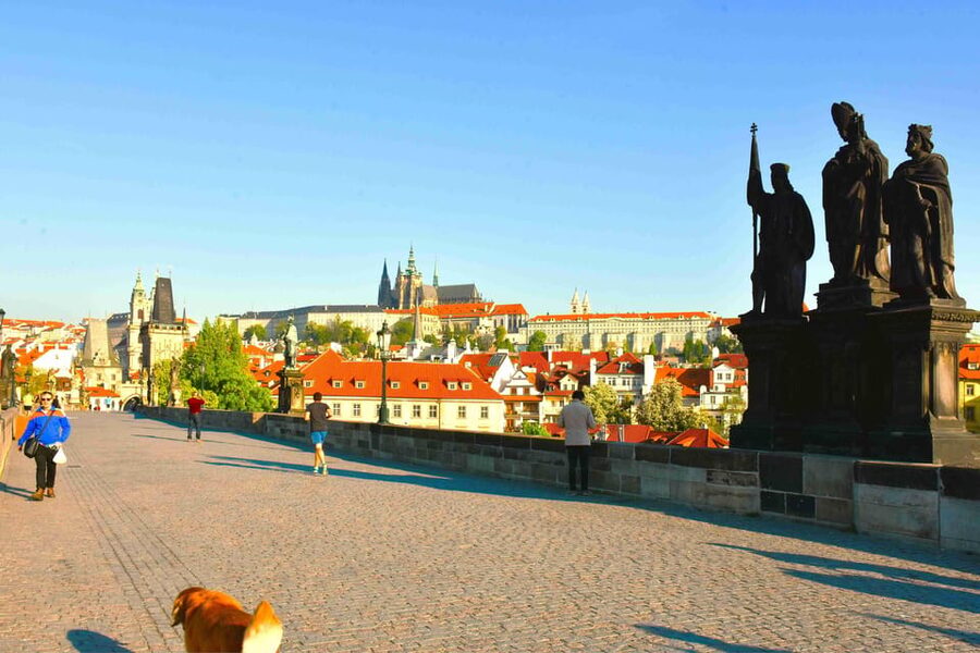 Prague: Charles Bridge Audio Guide with Tower Entry Ticket - Crossing Charles Bridge with context