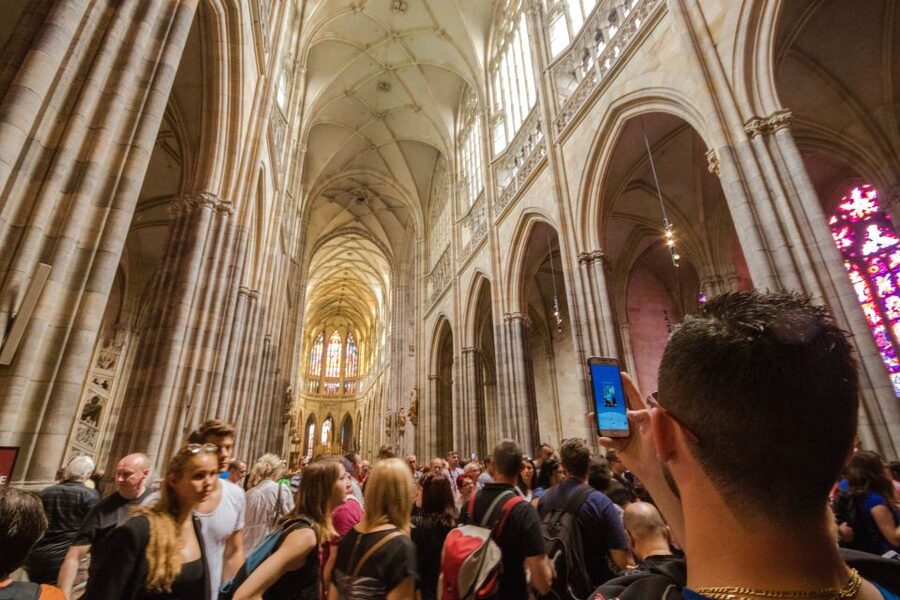 Prague: Guided Bus & Walking Tour with River Cruise & Lunch - Walking from the castle steps to Charles Bridge