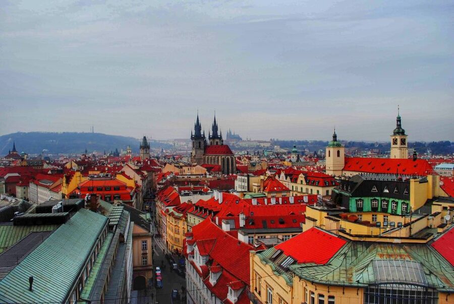 Prague Half-Day Private Walking Tour - Crossing the Charles Bridge with its statues