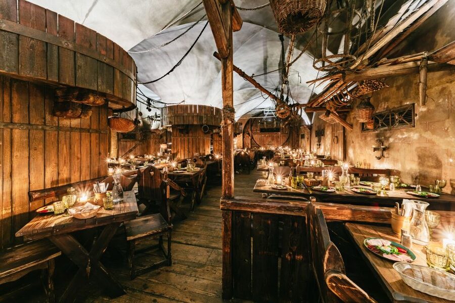 Prague: Medieval Dinner with Unlimited Drinks - Walking into U Pavouka’s medieval tavern