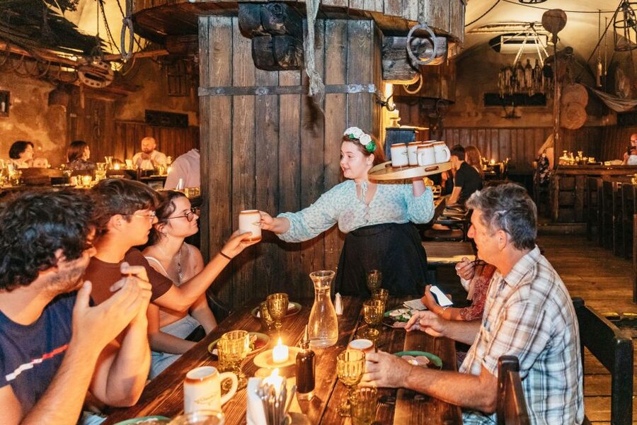 Prague: Medieval Dinner with Unlimited Drinks - Shared tables, crowded seating, and the social side