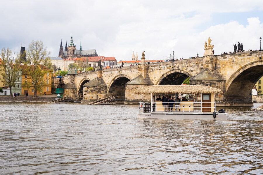 Prague: Party Tiki Boat Sightseeing Cruise with Drinks - From the National Theater toward Charles Bridge