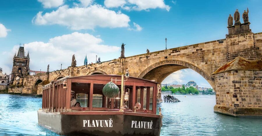 Prague: River Cruise, Charles Bridge Museum, & Walking Tour - Crossing from city streets to the historical boat
