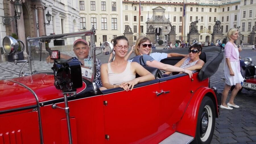 Prague: Vintage Car Ride and Walking Tour - Crossing Charles Bridge on foot