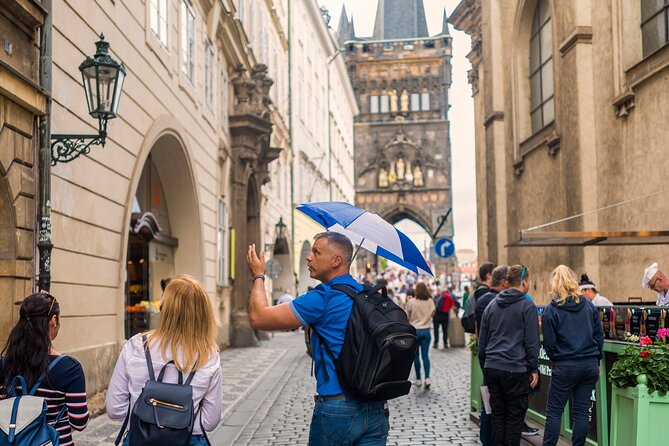 Prague Walking Tour with River Boat Cruise and Lunch - 6 hours - Crossing Charles Bridge toward the castle